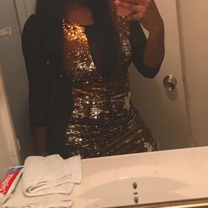 a gold and silver sheer body dress